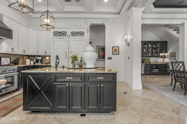 1511 18th Ave, Gulfport, MS 39501 - kitchen featuring white cabinets, high end stainless steel range, crown molding, dark cabinets, and decorative backsplash