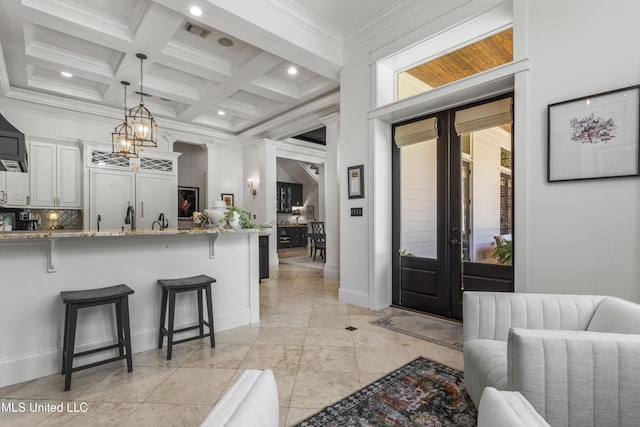 1511 18th Ave, Gulfport, MS 39501 - foyer entrance with crown molding, beamed ceiling, french doors, coffered ceiling, and a chandelier