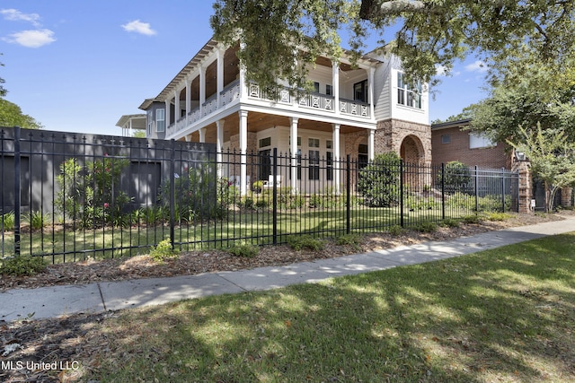 1511 18th Ave, Gulfport, MS 39501 - view of front of property with a balcony, stone siding, and brick siding