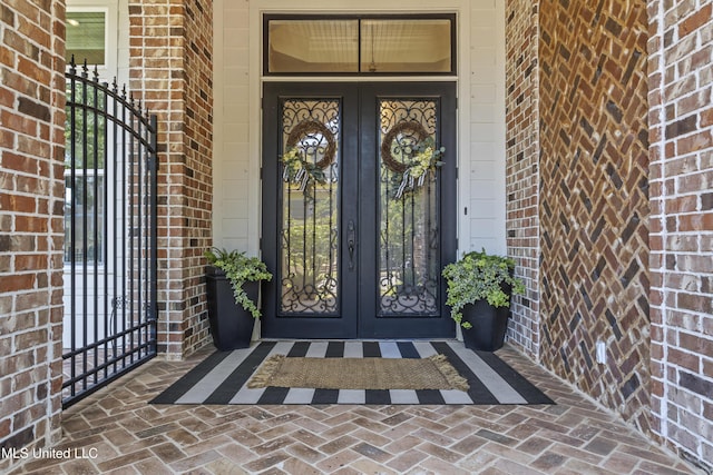 1511 18th Ave, Gulfport, MS 39501 - doorway to property featuring brick siding and french doors