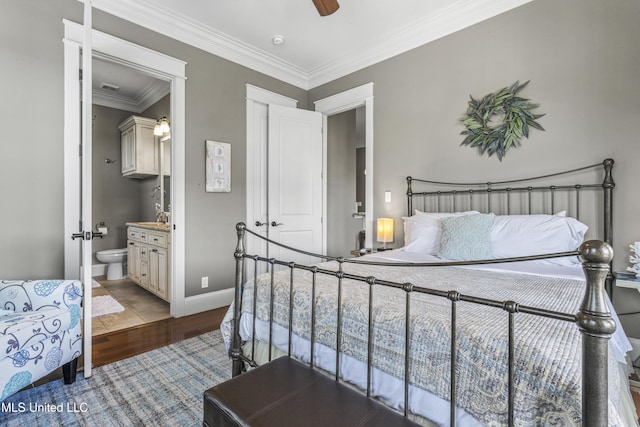 1511 18th Ave, Gulfport, MS 39501 - bedroom with ornamental molding, ensuite bath, wood finished floors, a ceiling fan, and baseboards