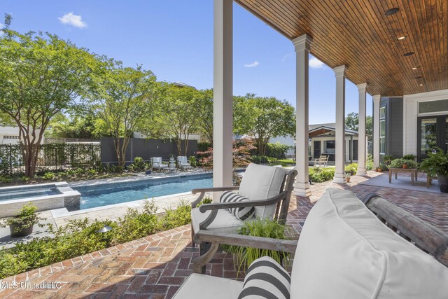 1511 18th Ave, Gulfport, MS 39501 - view of patio featuring an outdoor hangout area and a pool with connected hot tub