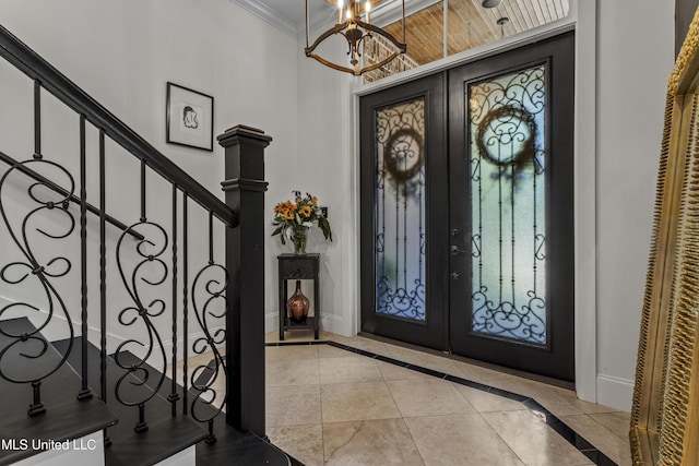 1511 18th Ave, Gulfport, MS 39501 - foyer entrance featuring french doors, baseboards, crown molding, a chandelier, and stairs