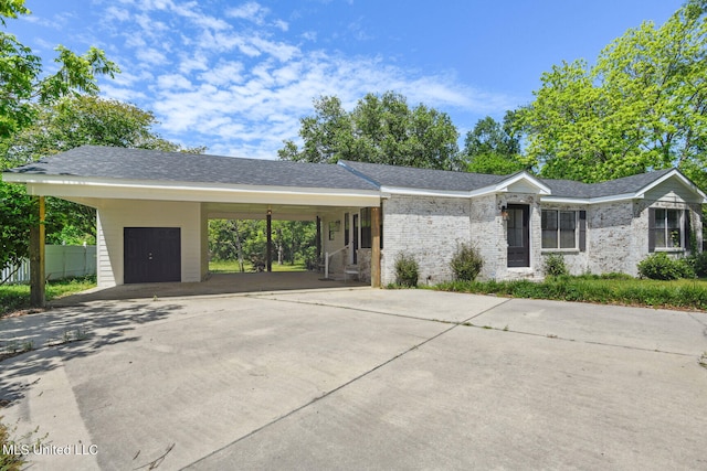 view of front of property featuring a carport