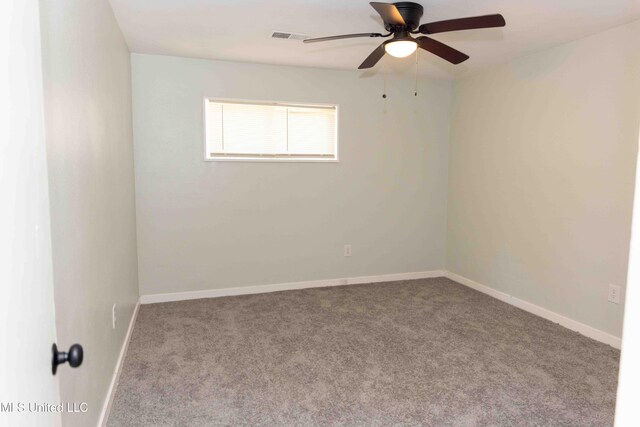 unfurnished room featuring ceiling fan and light carpet