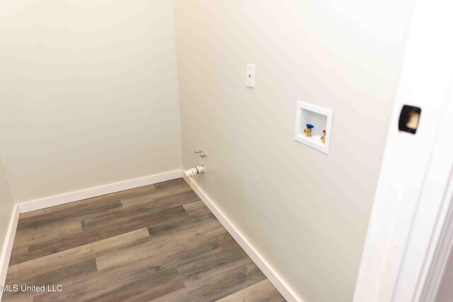 laundry room with hookup for a washing machine and dark wood-type flooring