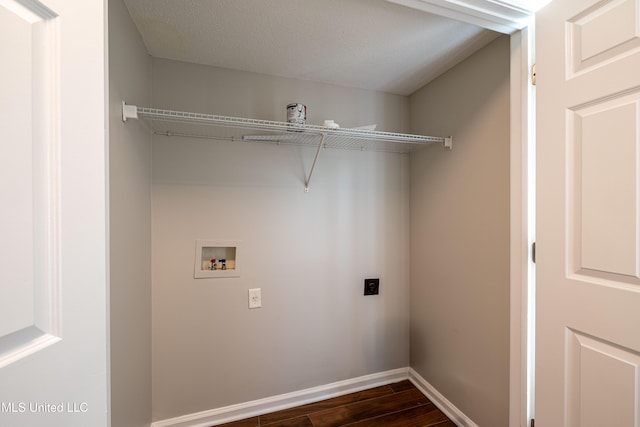 7241 Illinois Central Ave, Horn Lake, MS 38637 - laundry room with electric dryer hookup, washer hookup, dark wood finished floors, and baseboards