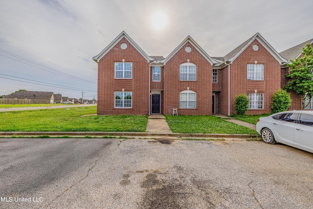 7241 Illinois Central Ave, Horn Lake, MS 38637 - view of front of home featuring brick siding and a front lawn