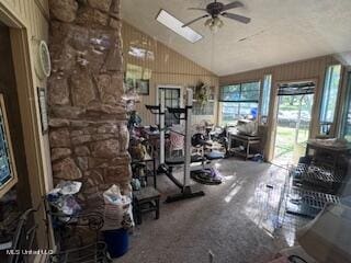 workout area featuring lofted ceiling and ceiling fan