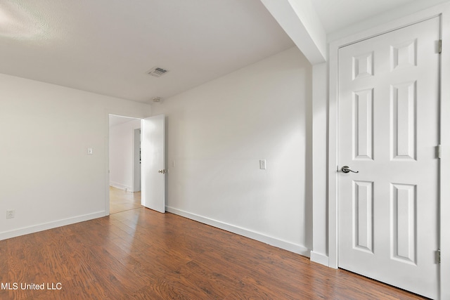 unfurnished bedroom featuring hardwood / wood-style flooring