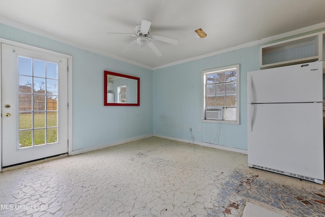 unfurnished room featuring cooling unit, ceiling fan, and ornamental molding