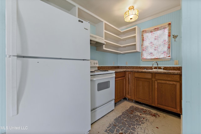 kitchen featuring white appliances and sink