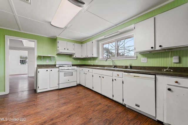 kitchen with white cabinetry, white appliances, sink, and dark hardwood / wood-style floors