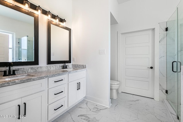 bathroom featuring vanity, toilet, and walk in shower