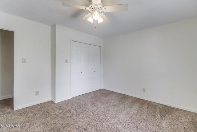 115 Shady Dr, Long Beach, MS 39560 - unfurnished bedroom featuring carpet flooring, a closet, and a ceiling fan