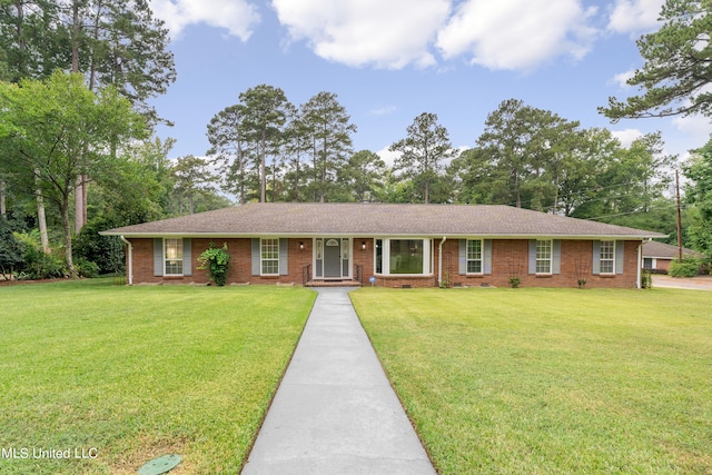 single story home with a front yard