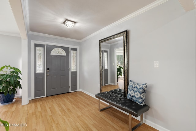 entrance foyer with ornamental molding and wood-type flooring