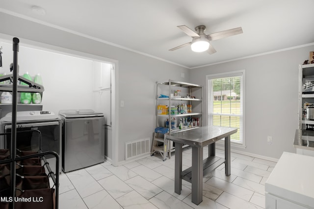 interior space featuring crown molding, washing machine and dryer, and ceiling fan