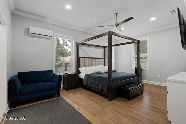 bedroom with ceiling fan, ornamental molding, light hardwood / wood-style flooring, and a wall unit AC