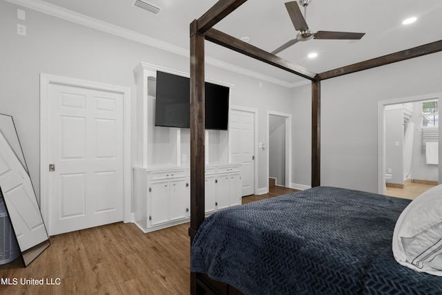 bedroom with crown molding, ensuite bath, light wood-type flooring, and ceiling fan