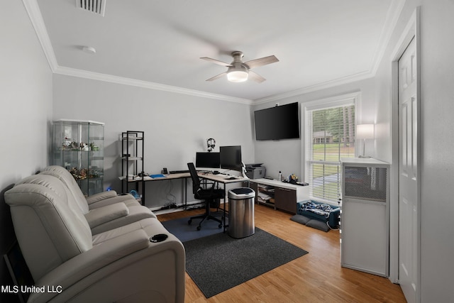 office space featuring crown molding, light wood-type flooring, and ceiling fan