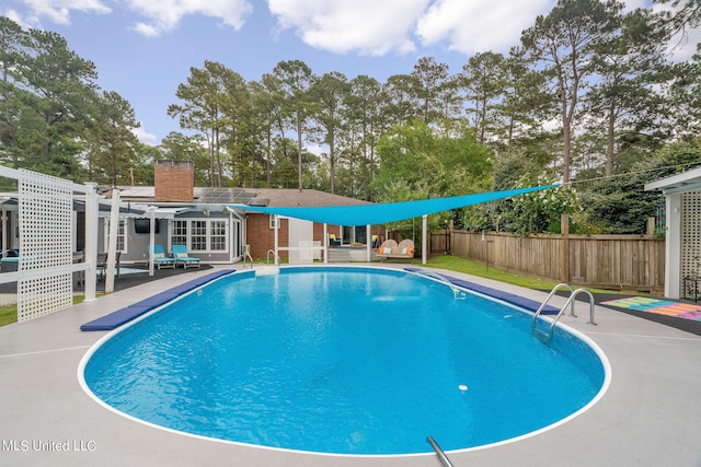 view of swimming pool featuring a patio