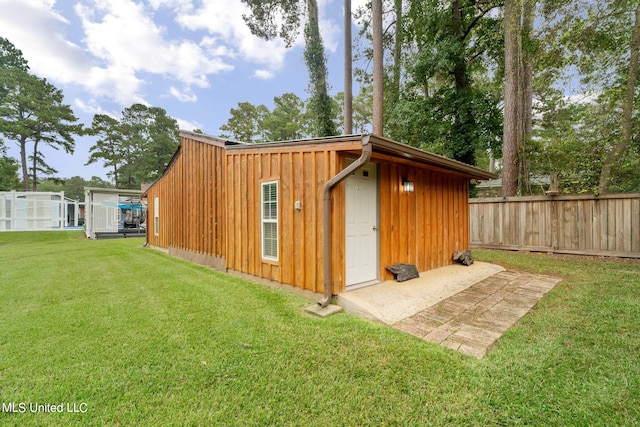 view of outdoor structure featuring a yard