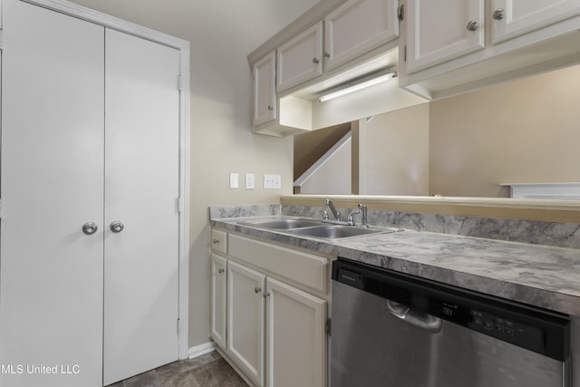 2383 Trafalgar Dr, Biloxi, MS 39531 - kitchen with dishwasher, light countertops, and white cabinetry