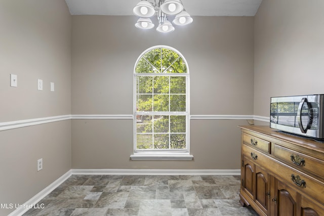 2383 Trafalgar Dr, Biloxi, MS 39531 - dining area featuring a chandelier and stone finish flooring