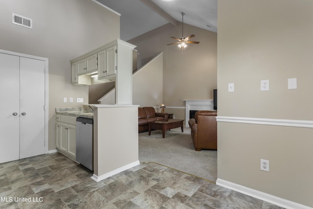 2383 Trafalgar Dr, Biloxi, MS 39531 - kitchen featuring dishwasher, high vaulted ceiling, a ceiling fan, stone finish floors, and white cabinetry