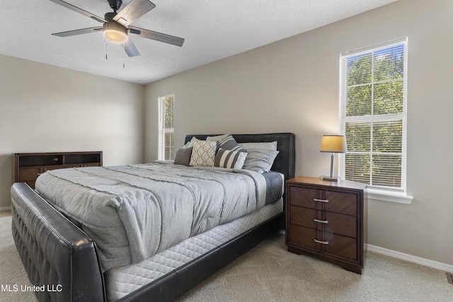2383 Trafalgar Dr, Biloxi, MS 39531 - bedroom with light carpet, a ceiling fan, and a textured ceiling