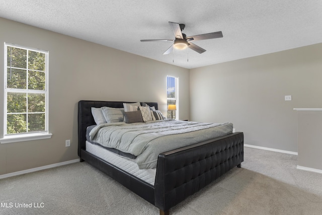 2383 Trafalgar Dr, Biloxi, MS 39531 - bedroom featuring carpet floors, a textured ceiling, and a ceiling fan