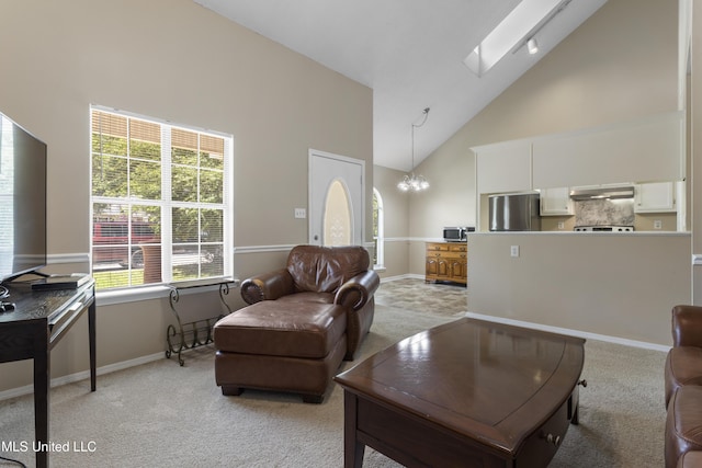 2383 Trafalgar Dr, Biloxi, MS 39531 - living area with high vaulted ceiling, light colored carpet, a chandelier, and a skylight