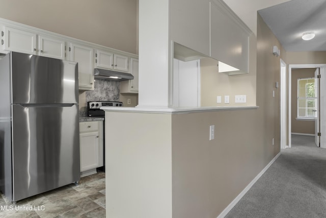 2383 Trafalgar Dr, Biloxi, MS 39531 - kitchen featuring freestanding refrigerator, under cabinet range hood, decorative backsplash, and white cabinetry