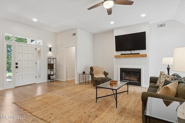4275 Bienville Rd, Nesbit, MS 38651 - living room with wood finished floors, a fireplace, a ceiling fan, recessed lighting, and baseboards