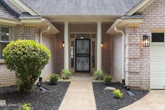 4275 Bienville Rd, Nesbit, MS 38651 - doorway to property featuring roof with shingles and brick siding