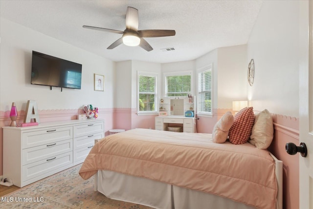 4275 Bienville Rd, Nesbit, MS 38651 - bedroom featuring a textured ceiling, light wood-style flooring, and ceiling fan