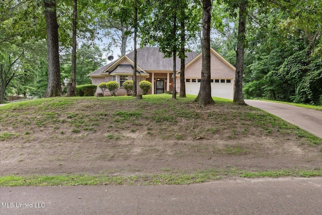 4275 Bienville Rd, Nesbit, MS 38651 - view of front of house featuring a garage and concrete driveway