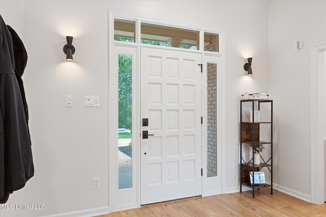 4275 Bienville Rd, Nesbit, MS 38651 - foyer featuring light wood finished floors, baseboards, and healthy amount of natural light