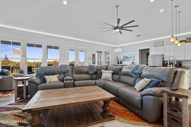 14 Sherman Ave, Pass Christian, MS 39571 - living area with crown molding, ceiling fan with notable chandelier, plenty of natural light, and visible vents