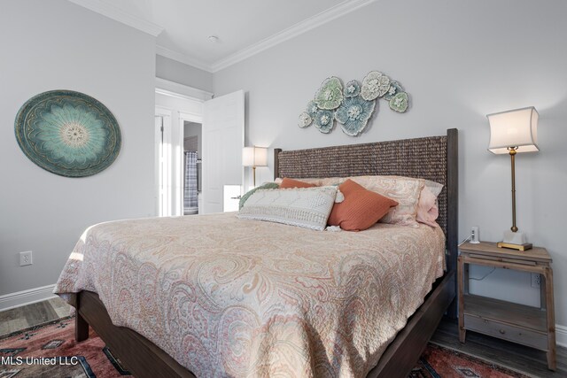 14 Sherman Ave, Pass Christian, MS 39571 - bedroom with ornamental molding, baseboards, and wood finished floors