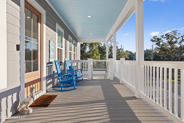 14 Sherman Ave, Pass Christian, MS 39571 - wooden deck featuring a porch