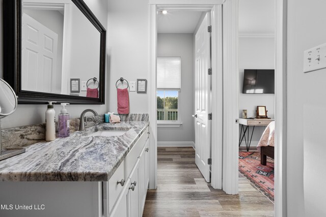 14 Sherman Ave, Pass Christian, MS 39571 - bathroom with baseboards, vanity, and wood finished floors