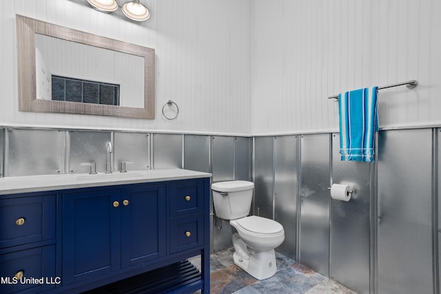 14 Sherman Ave, Pass Christian, MS 39571 - bathroom featuring vanity, toilet, and a decorative wall