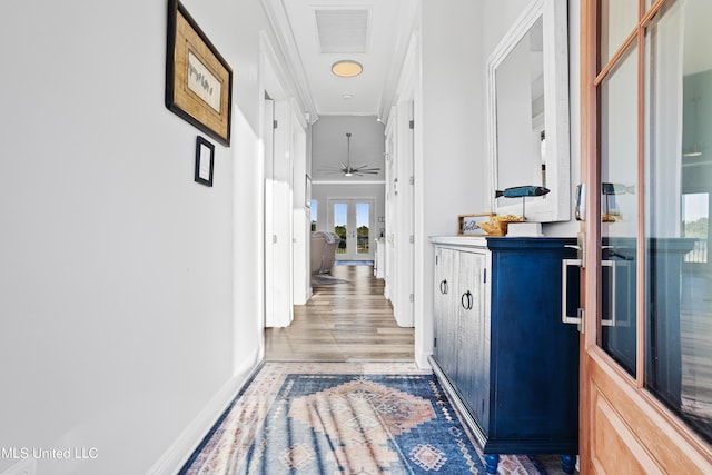 14 Sherman Ave, Pass Christian, MS 39571 - hall featuring wood finished floors, french doors, visible vents, baseboards, and ornamental molding