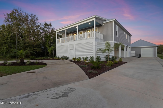 14 Sherman Ave, Pass Christian, MS 39571 - raised beach house featuring an outbuilding, driveway, and a balcony