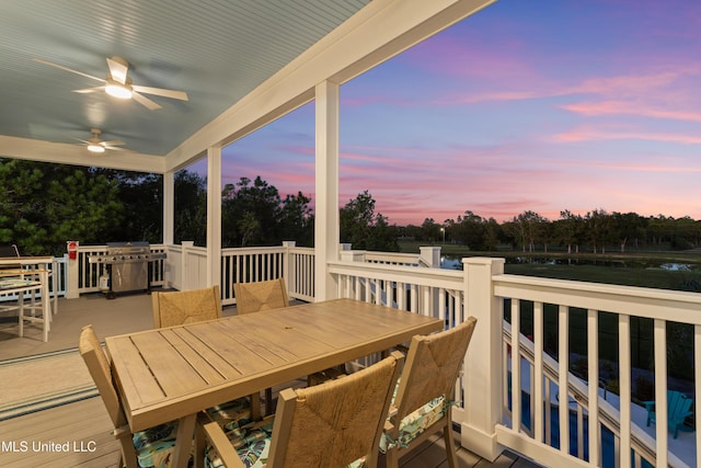 14 Sherman Ave, Pass Christian, MS 39571 - deck at dusk featuring ceiling fan, grilling area, and outdoor dining space