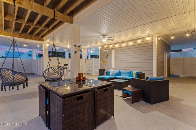 14 Sherman Ave, Pass Christian, MS 39571 - view of patio featuring an outdoor living space with a fire pit, fence, and a ceiling fan