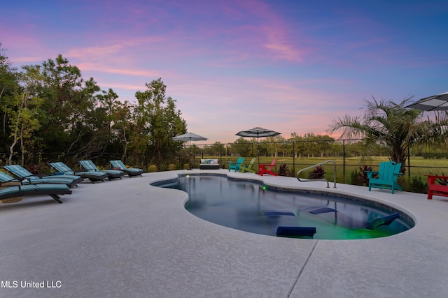 14 Sherman Ave, Pass Christian, MS 39571 - pool at dusk featuring a patio area, fence, and a fenced in pool