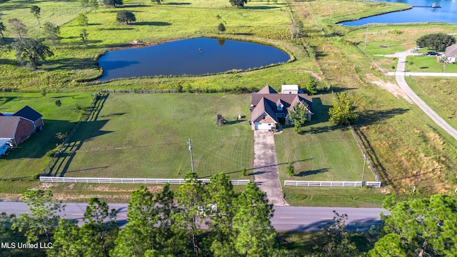 birds eye view of property featuring a water view and a rural view